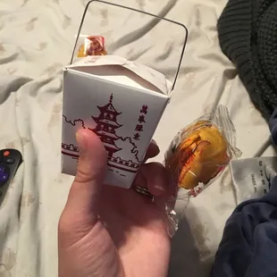 Tiniest side of uncle ben&apos;s rice I&apos;ve ever seen and a pre-crushed fortune cookie.