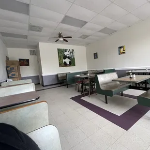 a restaurant with tables and benches