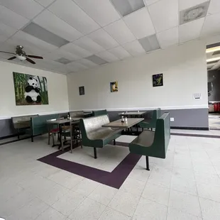 a restaurant with a panda painting on the wall