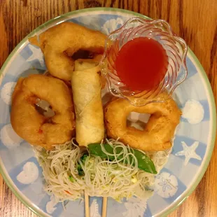 Food from Golden China taken back home.  Those ' donuts' are sweet and sour shrimp.