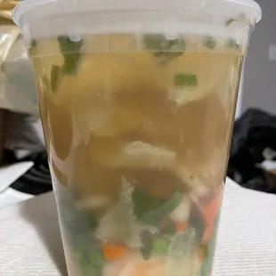 Seafood Soup (shrimp, squid, scallops, tofu, cabbage, carrots, peas, chives, in a mild broth)