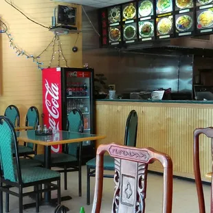 Eight 4-top tables inside Golden China to eat some "take-away" while the food is fresh &amp; hot out of the wok.