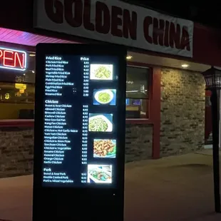 a menu displayed in front of a restaurant