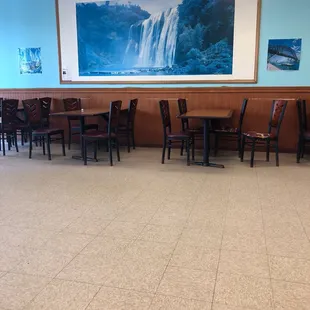 a dining room with tables and chairs