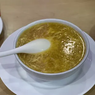 a bowl of soup with a spoon