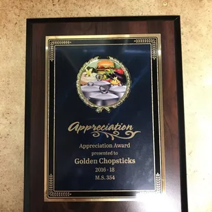 an award plaque on a wall