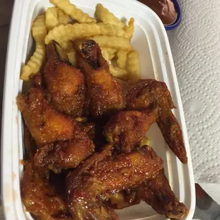 BBQ chicken wings with fries. Really good. Love the BBQ sauce on the wings.