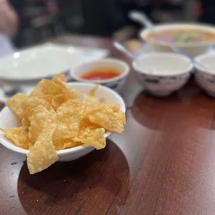 Fried egg roll wrappers and delicious sweet &amp; sour dipping sauce