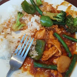 a plate of food with rice and broccoli