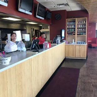 a woman behind a counter