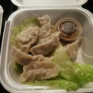 Steamed dumplings. They were filled with chicken, not pork like most places.