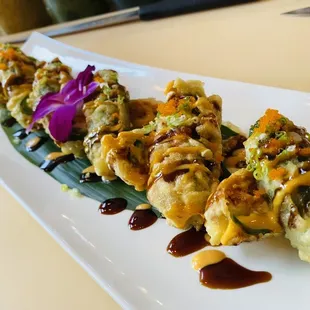 a plate of sushi rolls
