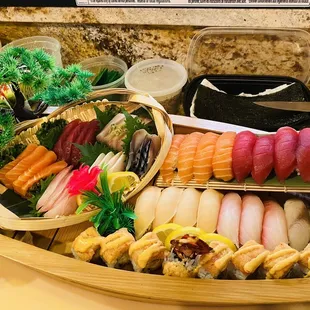 a variety of sushi in a boat