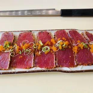 a plate of raw tuna