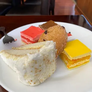 a variety of desserts on a white plate