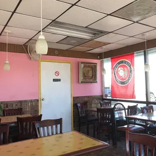 a dining area with tables and chairs
