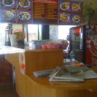 a restaurant counter and menus