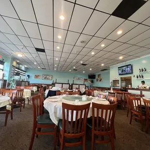 a dining room with tables and chairs