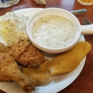 Fried chicken and catfish, mashed potatoes with gravy and extra gravy. Yum!