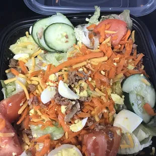 This is what I got when I ordered the Cobb salad. They added no ham or blue cheese. Compare with their advertisement pic.