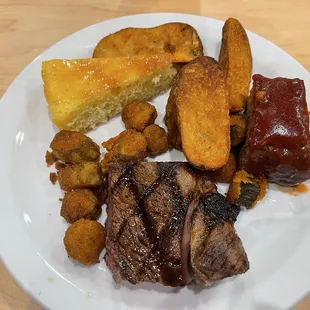 Fried okra, steak, meatloaf, potato wedges and cornbread :)