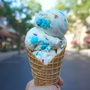 an ice cream cone with sprinkles
