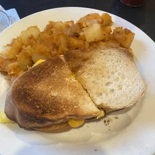 Breakfast sandwich-egg, cheese &amp; hot peppers with hash Browns