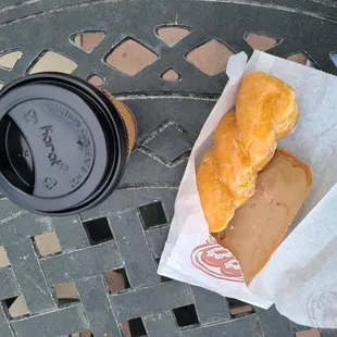 Glazed twist, maple bar, and large coffee