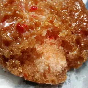 Crunchy, sweet bark with a hint of cherry encasing a spongy soft center...good cherry cake.