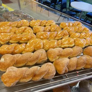 a variety of doughnuts on a cooling rack