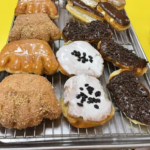 a variety of doughnuts on a tray