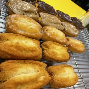 a variety of doughnuts on a cooling rack