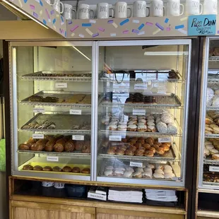a display case filled with donuts