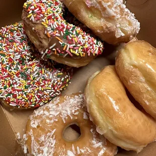 a variety of donuts with sprinkles