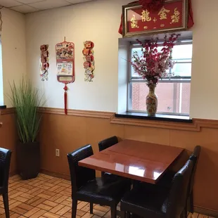 a chinese restaurant with tables and chairs