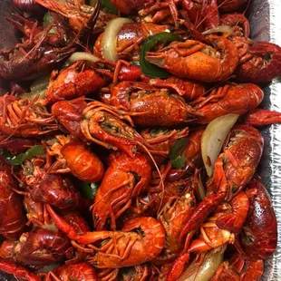 a tray of cooked craws