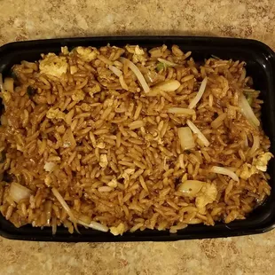 rice and vegetables in a black dish