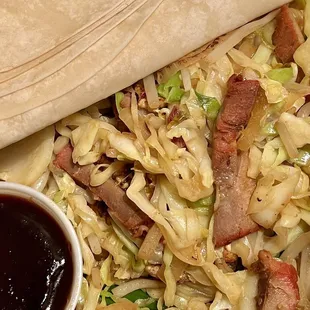 Mu-Shu Pork. Pork, egg, bean sprouts, green onion, cabbage, and white onions. "Pancakes" seem like flour tortillas, but thinner &amp; softer.