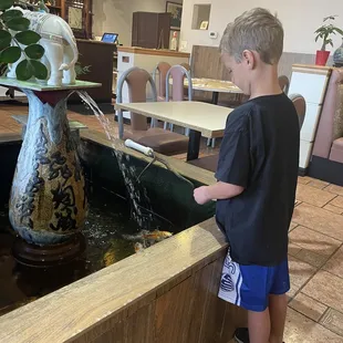 Son feeding the fish