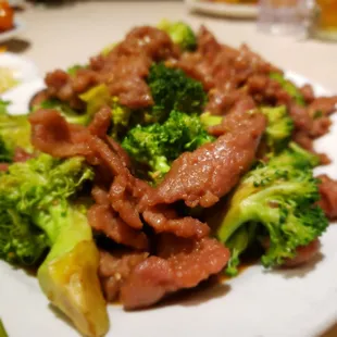 beef and broccoli on a white plate