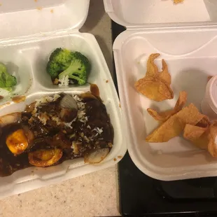 a meal in a styrofoam container