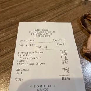 a receipt and a pair of scissors