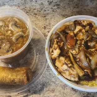 Lunch Szechuan Chicken with pork fried rice, hot and sour soup, and a  shrimp egg roll .