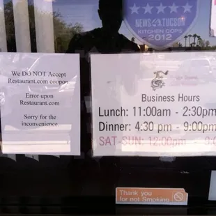 The hours and a notice about coupons.