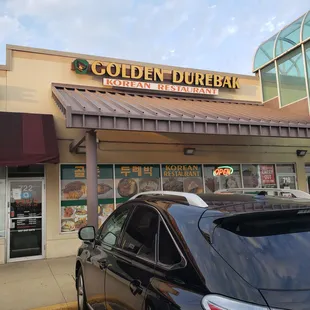 Strip mall storefront to the right of nearby &quot;Fresh Market&quot;