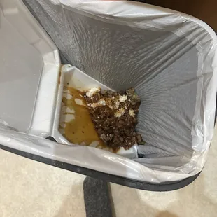 My Szechwan Beef  in the garbage where it belongs. Nasty!