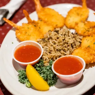 a plate of shrimp and rice