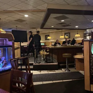Upper dining room with bar in front