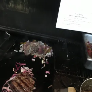 Burger with grilled onions and philly cheese steak
