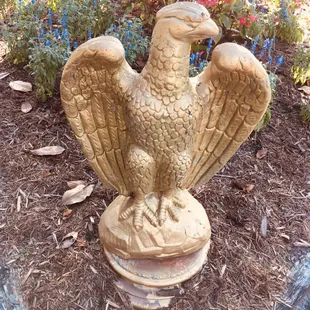 a statue of a golden eagle